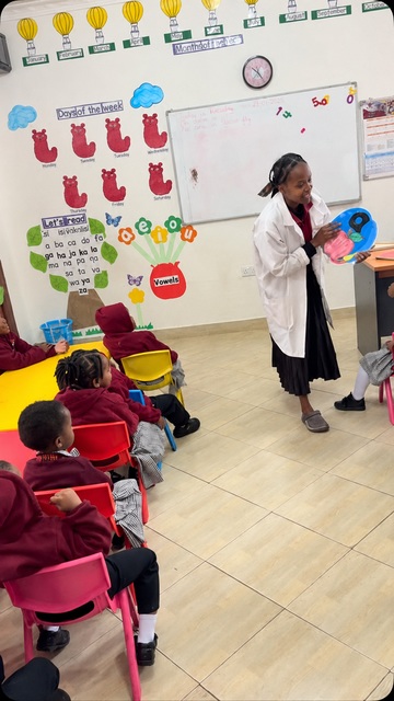 A teacher leading a kindergarten classroom learning activity